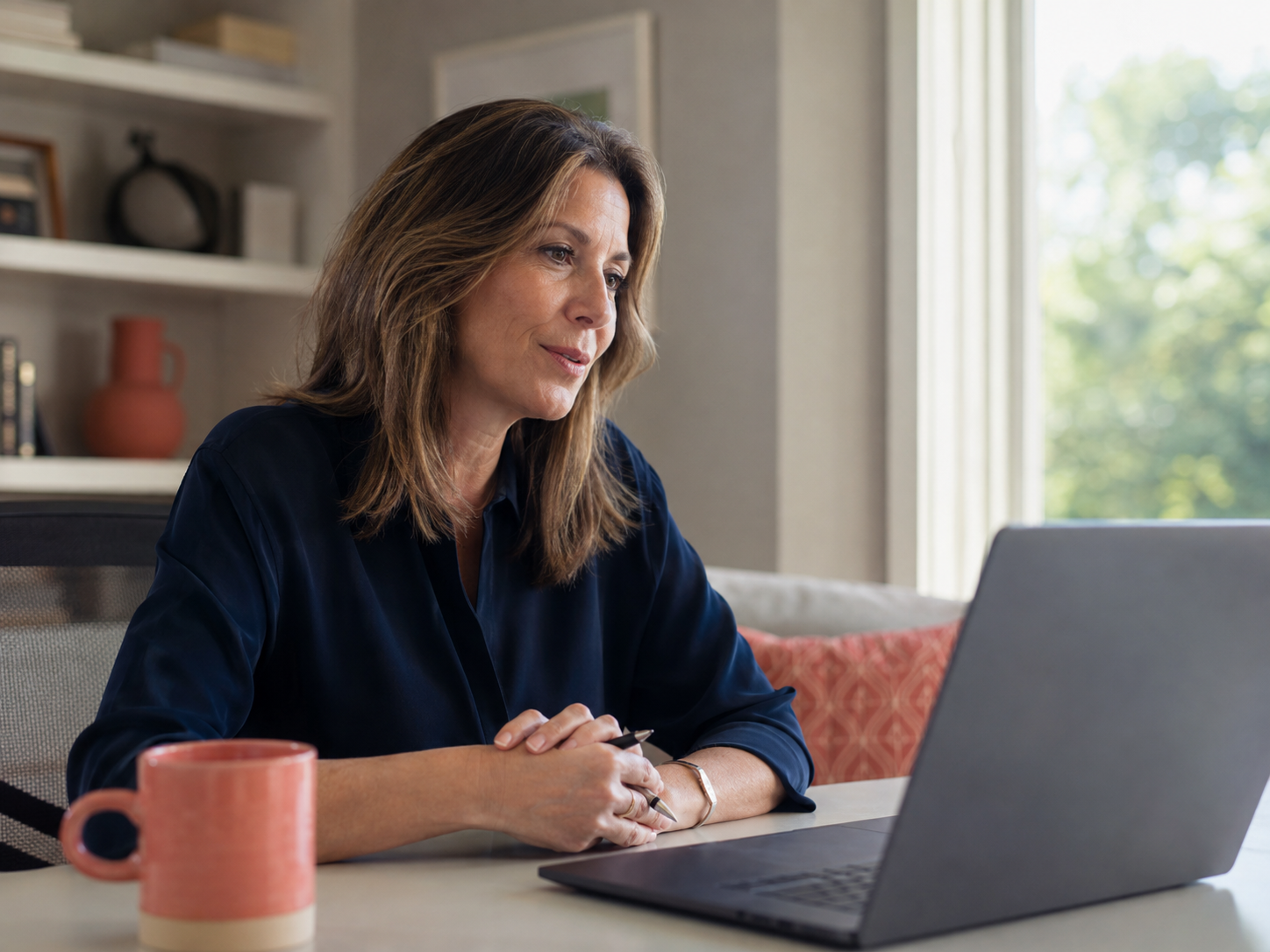 Illustrative image of an executive at her laptop, not a photograph of a DCX event